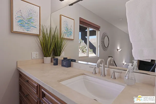 a kitchen with sink and a microwave
