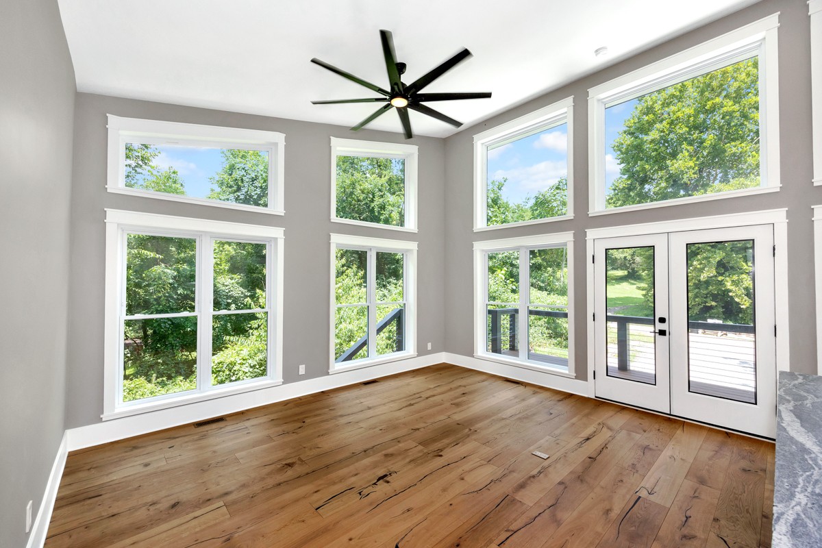 320 Park Street Pulaski, TN 38478 - Photo 1 of 46 a view of an empty room with wooden floor and a large window