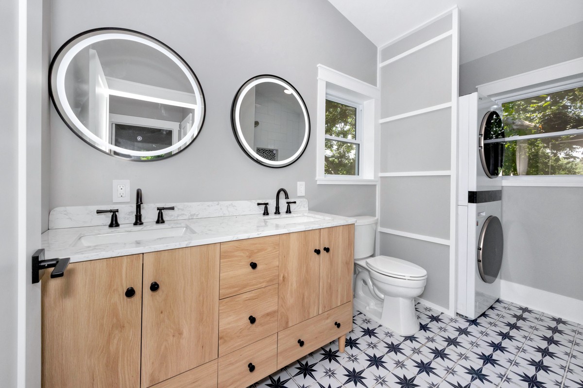 320 Park Street Pulaski, TN 38478 - Photo 16 of 46 a bathroom with a granite countertop toilet a sink and a mirror