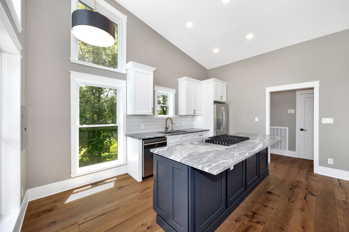 320 Park Street Pulaski, TN 38478 - Photo 28 of 46 a kitchen with a stove cabinets and wooden floor