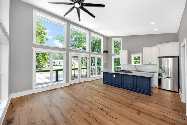 a view of an empty room and wooden floor