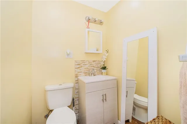 a bathroom with a shower sink vanity and mirror