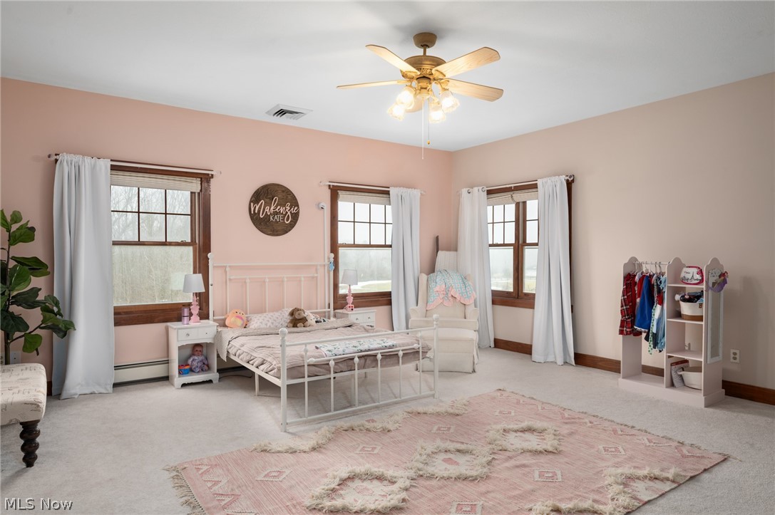 9419 Robinson Road Chardon, OH 44024 - Photo 32 of 46 Bedroom with light carpet, ceiling fan, and a baseboard radiator