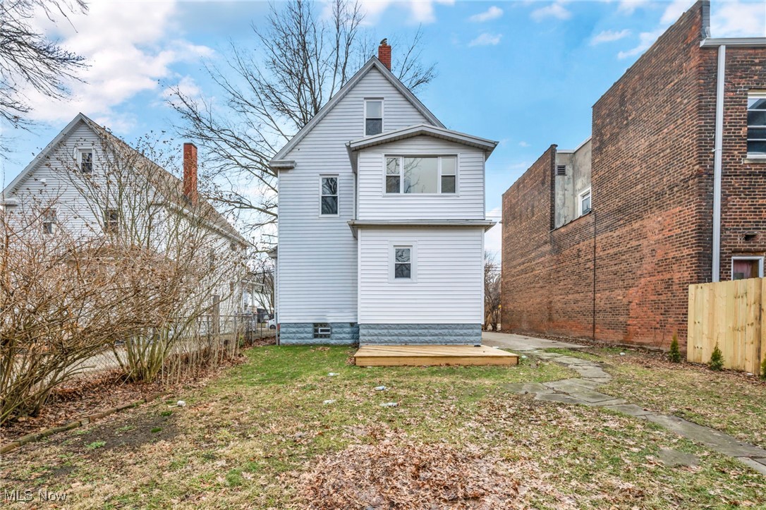1610 Spring Road Old Brooklyn, OH 44109 - Photo 37 of 38 Rear view of property with a yard, a chimney, and fence