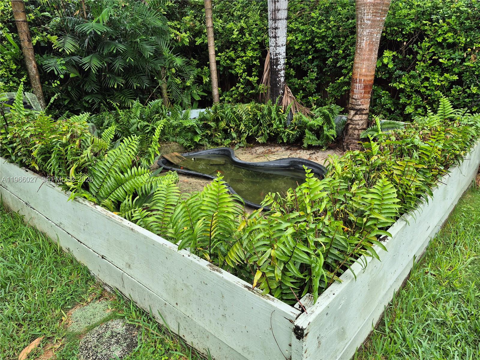 16721 Southwest 298th Terrace Homestead, FL 33030 - Photo 18 of 19 a view of a garden filled with plants