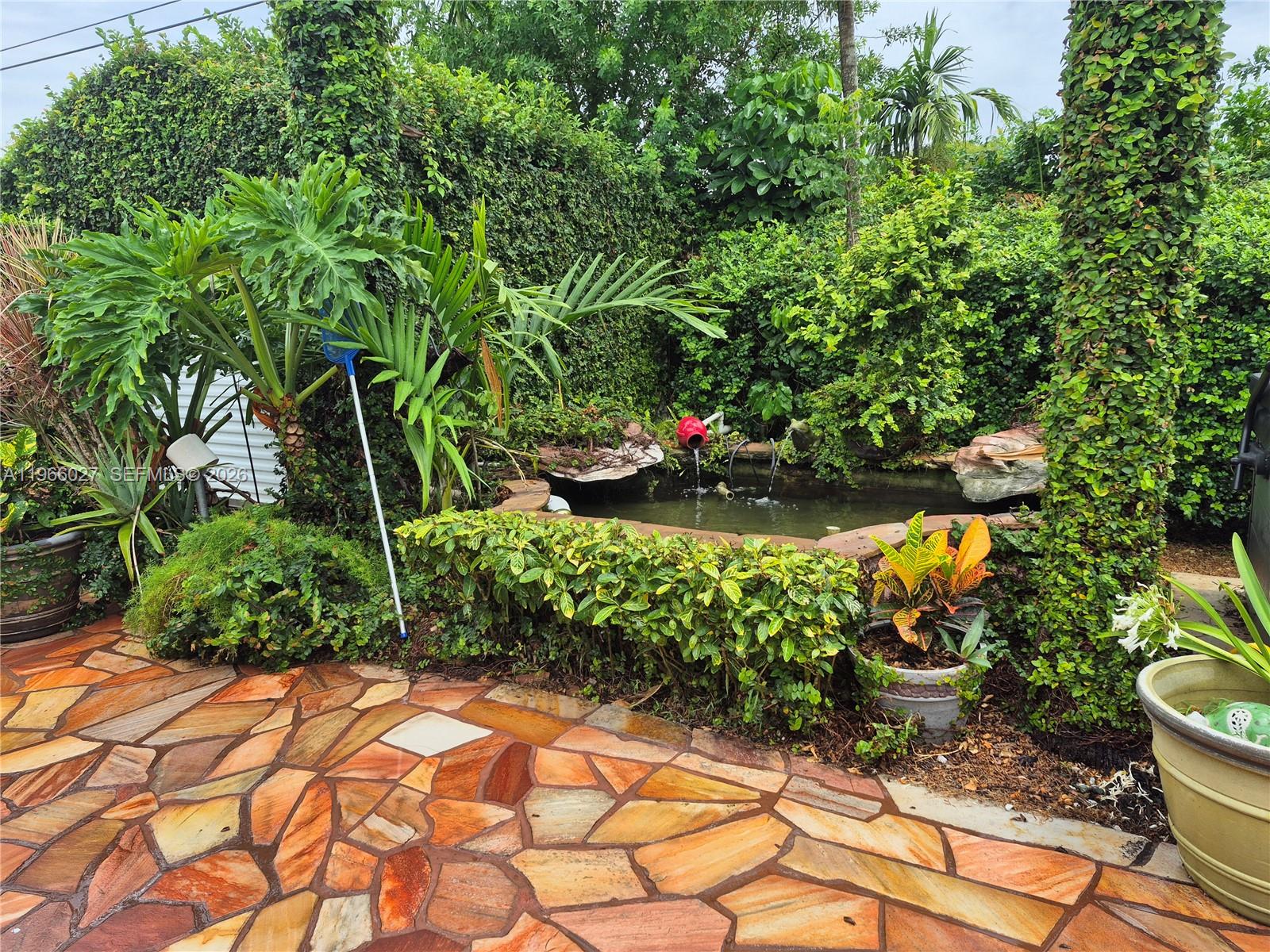 16721 Southwest 298th Terrace Homestead, FL 33030 - Photo 19 of 19 a view of a garden with plants and flowers