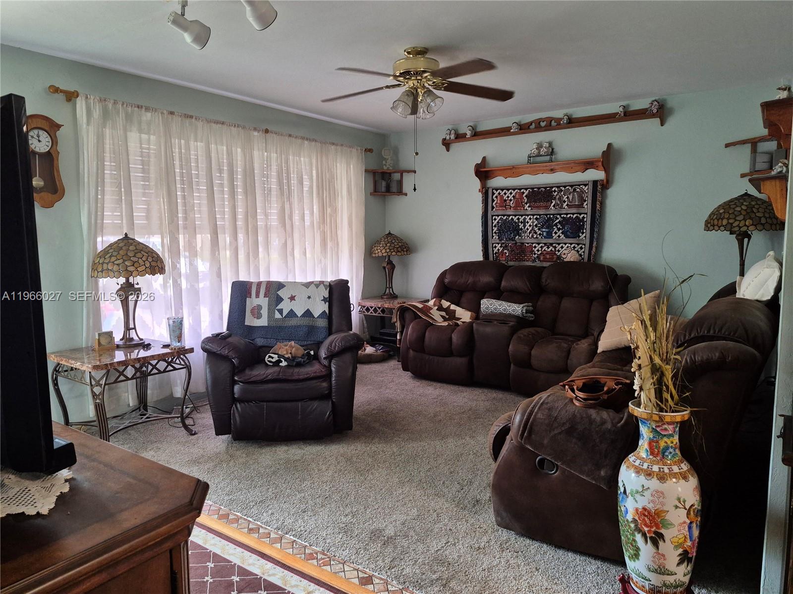 16721 Southwest 298th Terrace Homestead, FL 33030 - Photo 2 of 19 a living room with furniture and a window