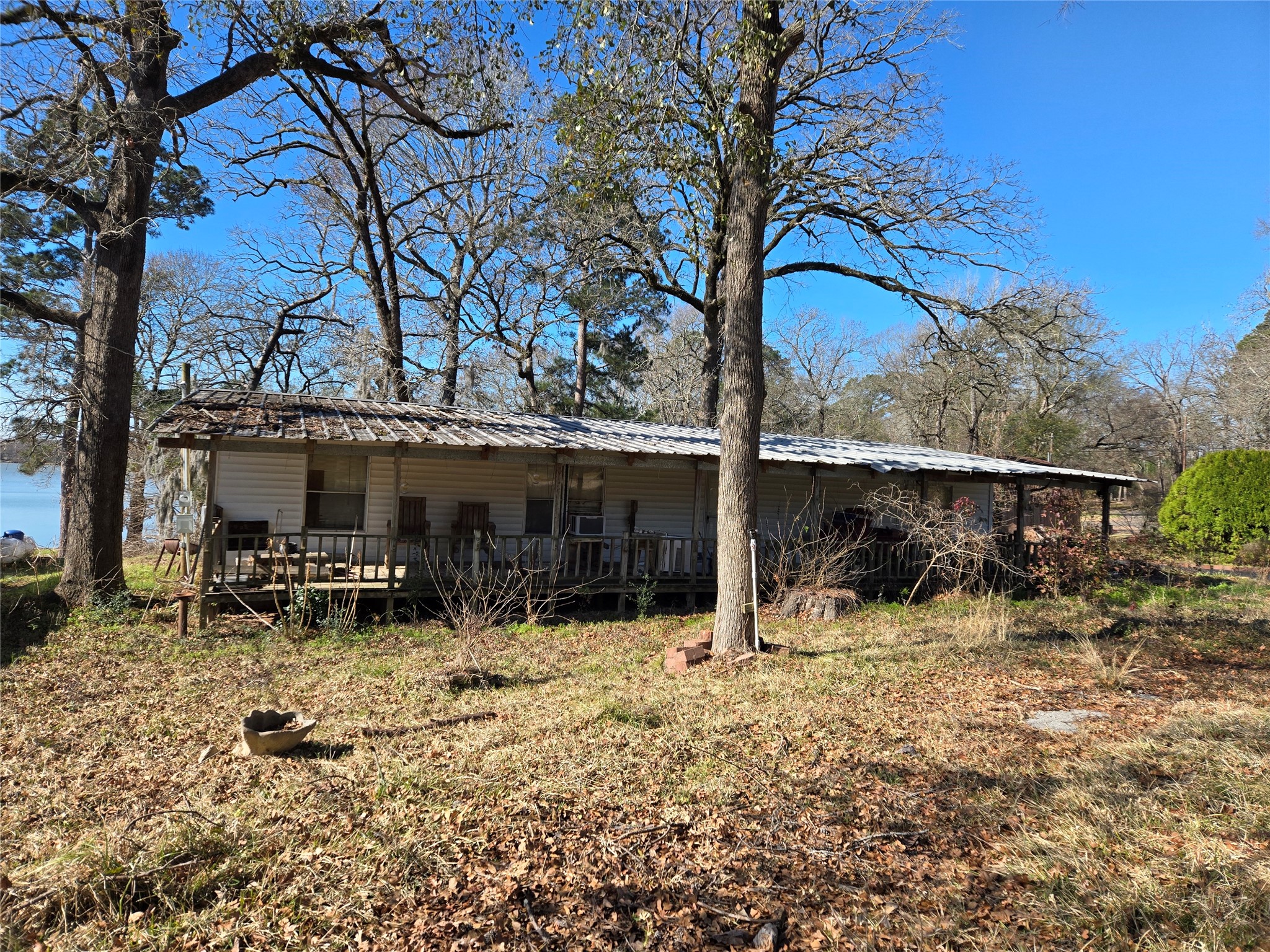 1188 Sportsman Drive Trinity, TX 75862 - Photo 16 of 26 a view of a house with a yard covered with snow