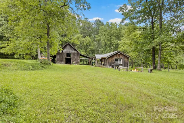 a house with huge green field in front of it