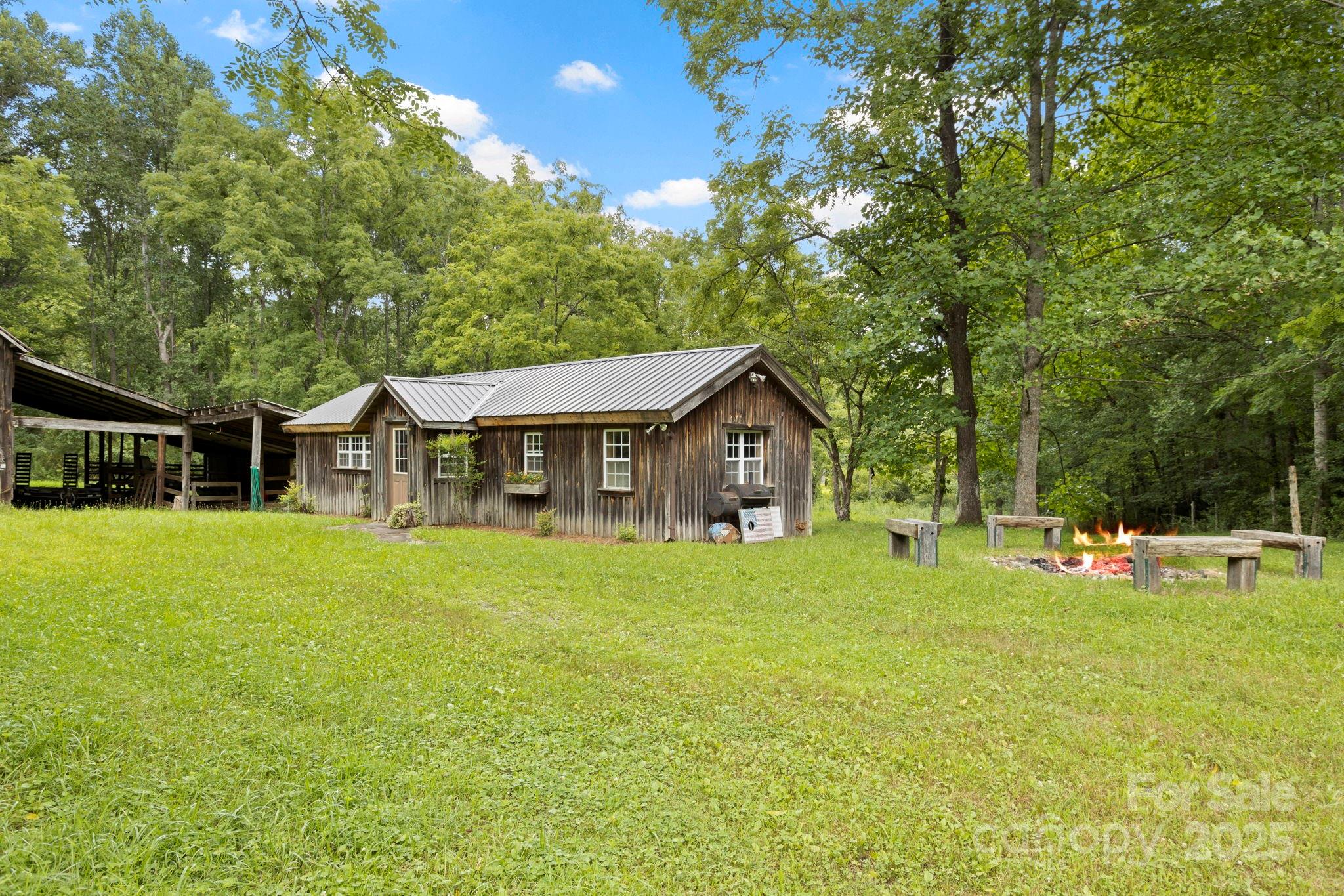 0 South Bobs Creek Road Zirconia, NC 28790 - Photo 2 of 31 a front view of a house with garden