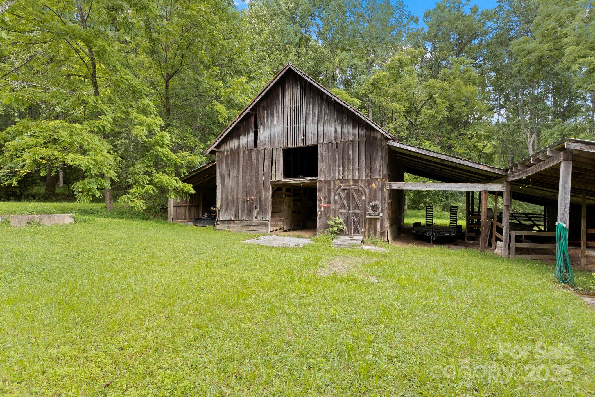 0 South Bobs Creek Road Zirconia, NC 28790 - Photo 4 of 31 a front view of house with yard and green space