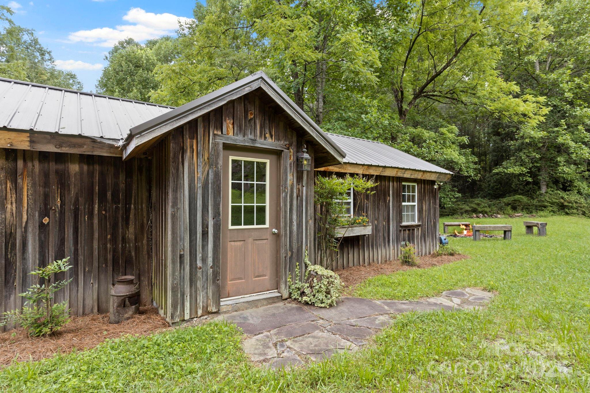 0 South Bobs Creek Road Zirconia, NC 28790 - Photo 5 of 31 a front view of a house with garden