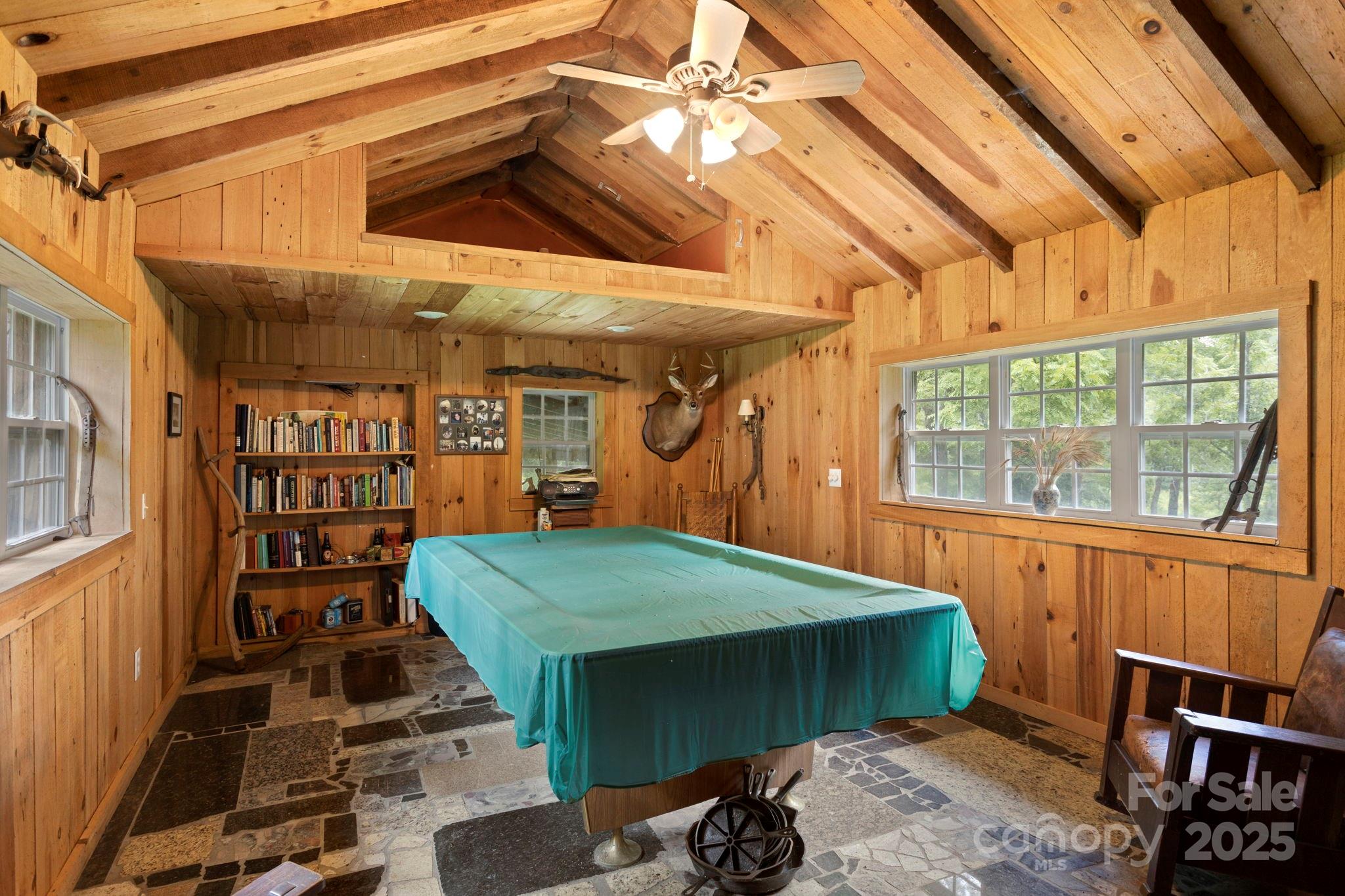 0 South Bobs Creek Road Zirconia, NC 28790 - Photo 6 of 31 a room with lots of wooden furniture and a window