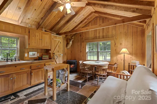 a view of a kitchen with furniture and windows