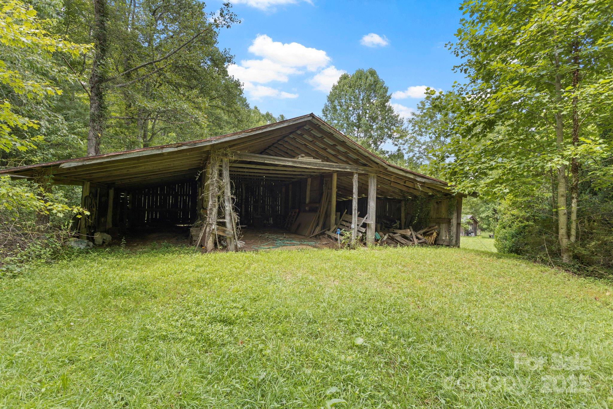 0 South Bobs Creek Road Zirconia, NC 28790 - Photo 10 of 31 a front view of a house with a garden