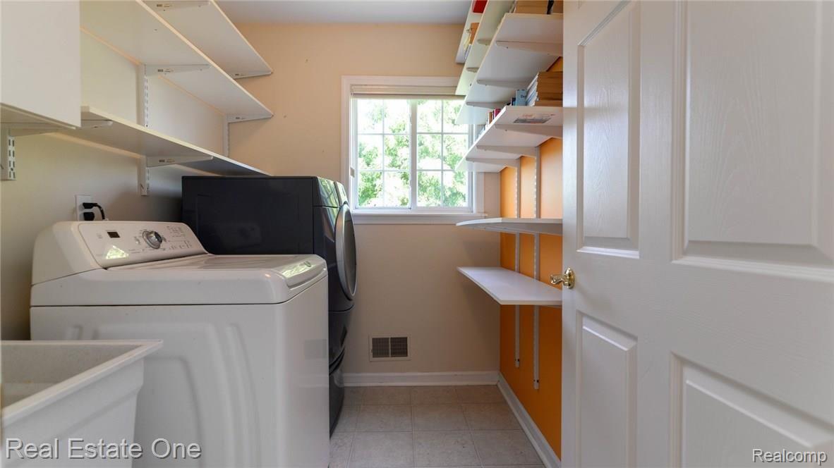 1824 Park Ridge Court Howell, MI 48843 - Photo 30 of 47 UPSTAIRS LAUNDRY CONVENIENTLY LOCATED TO BEDROOMS.