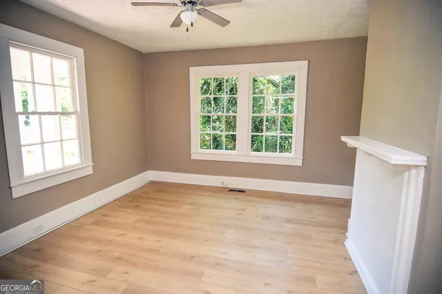 a view of an empty room with a window