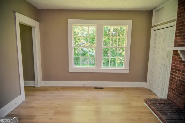 a view of an empty room with a window