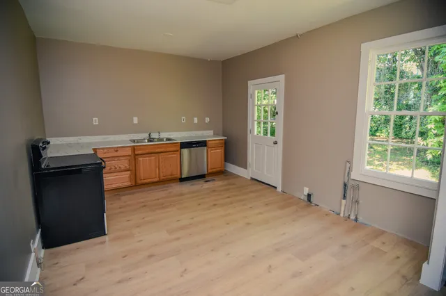 a view of a kitchen with granite countertop cabinets and a sink