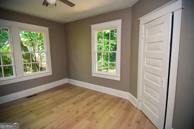 a view of an empty room with a window