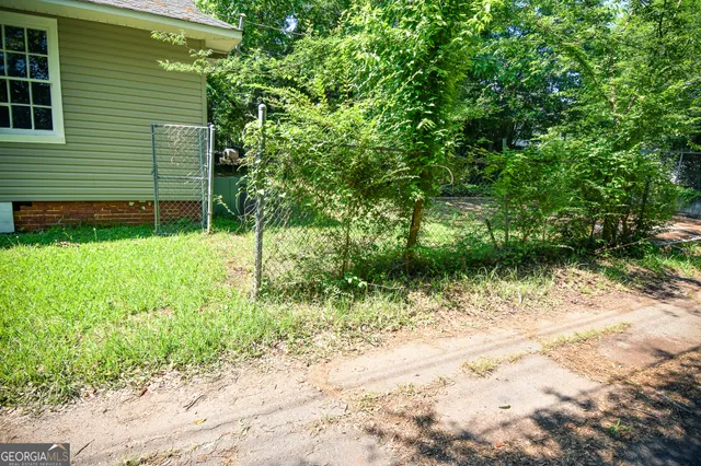 a backyard of a house with lots of green space