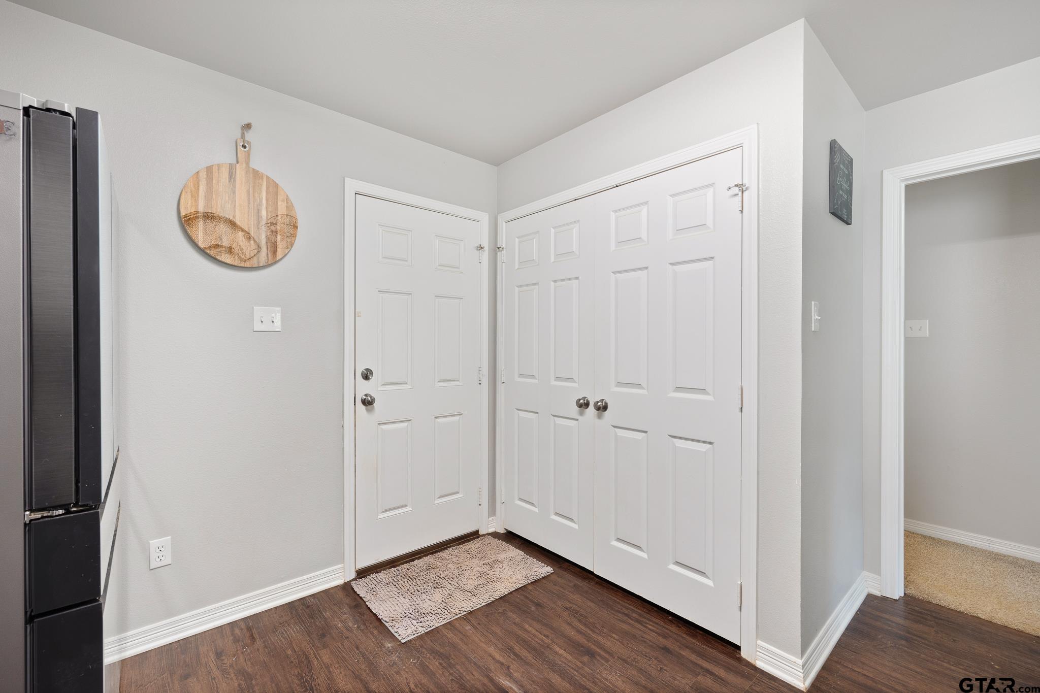 421 Alexander Street Kilgore, TX 75662 - Photo 14 of 24 a view of a hallway with wooden floor