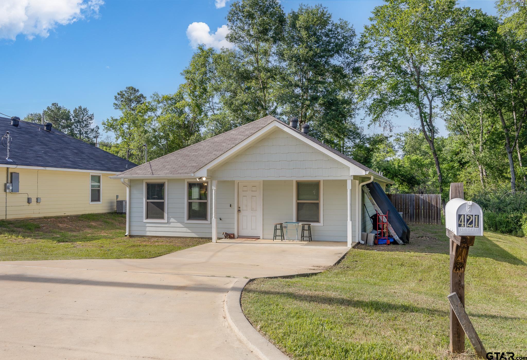 421 Alexander Street Kilgore, TX 75662 - Photo 2 of 24 a view of a house with basketball court