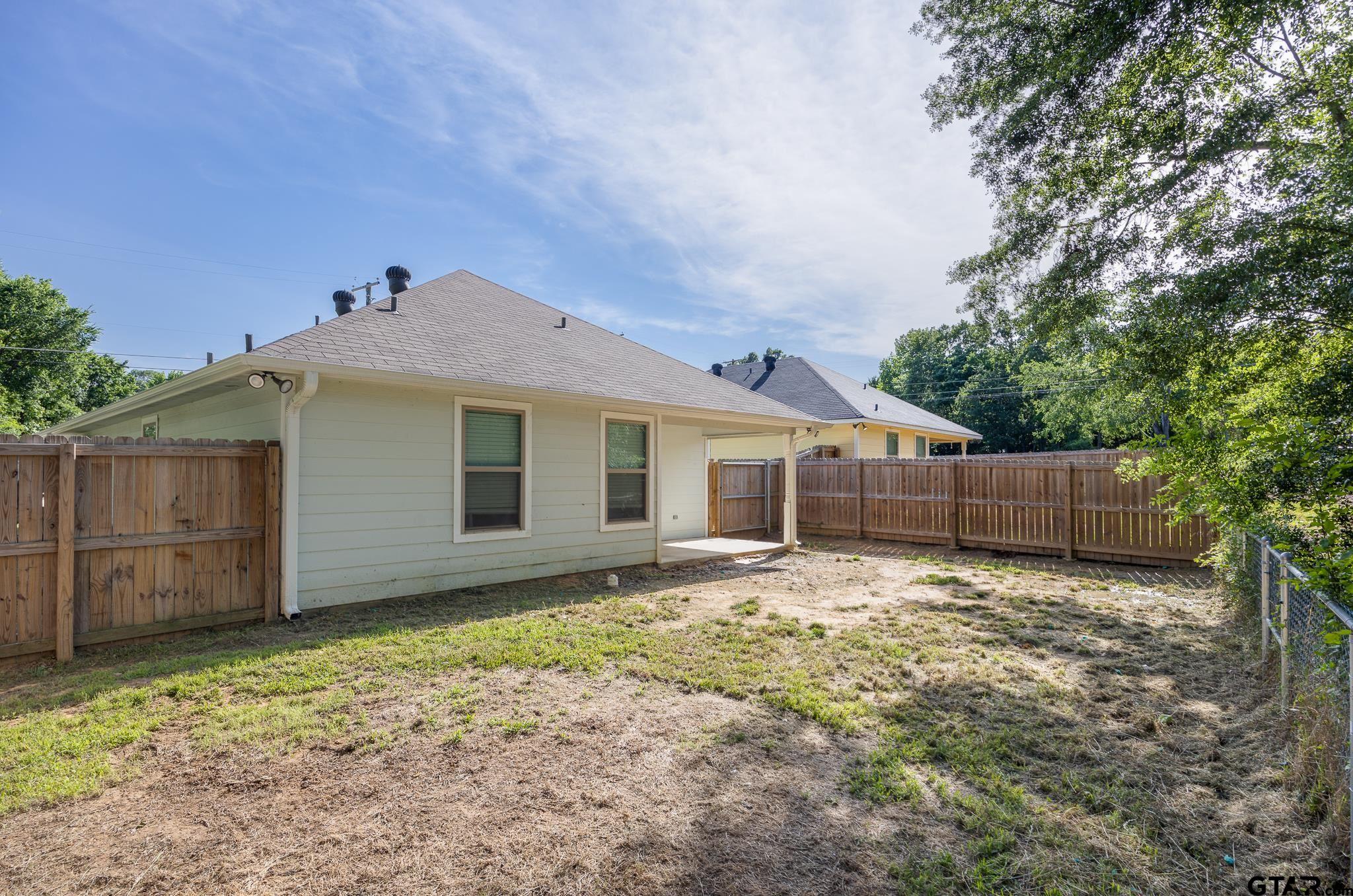 421 Alexander Street Kilgore, TX 75662 - Photo 21 of 24 a front view of a house with a yard