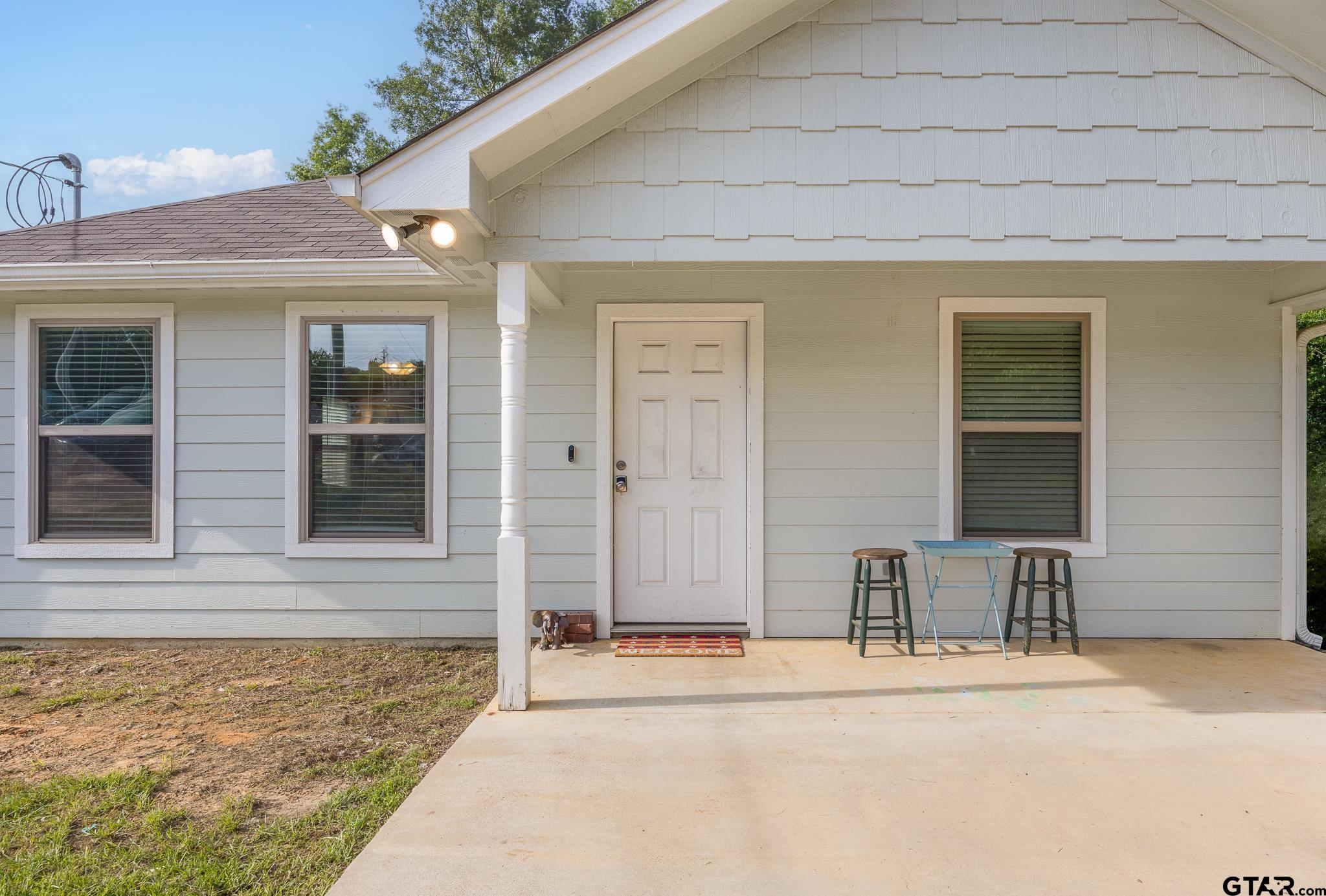 421 Alexander Street Kilgore, TX 75662 - Photo 4 of 24 a front view of a house with a yard