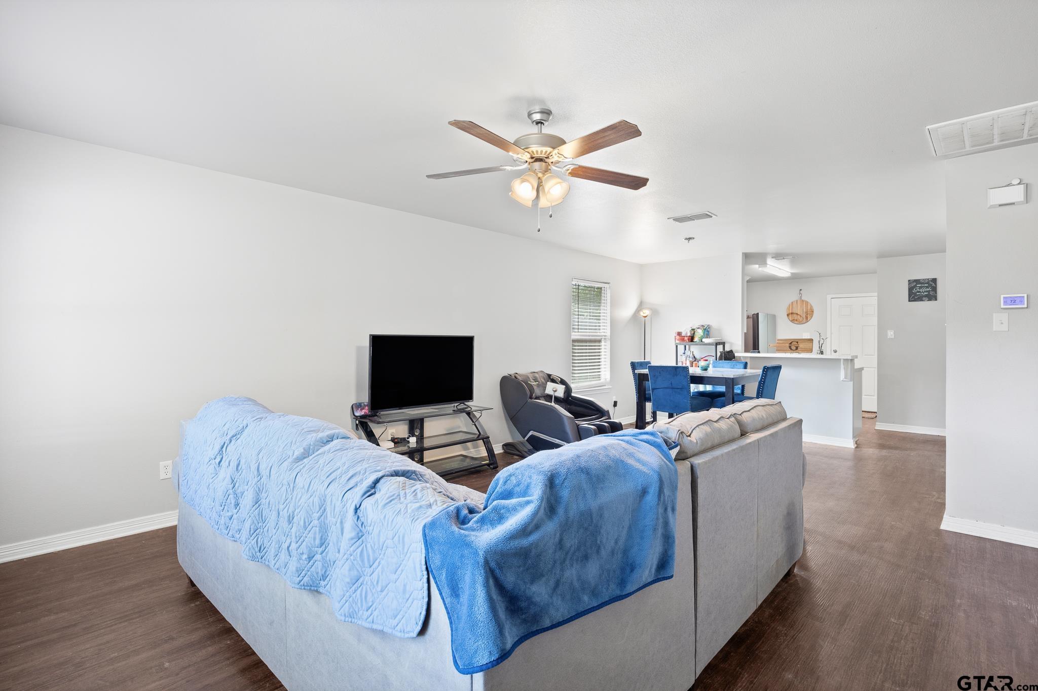 421 Alexander Street Kilgore, TX 75662 - Photo 5 of 24 a living room with furniture and a flat screen tv