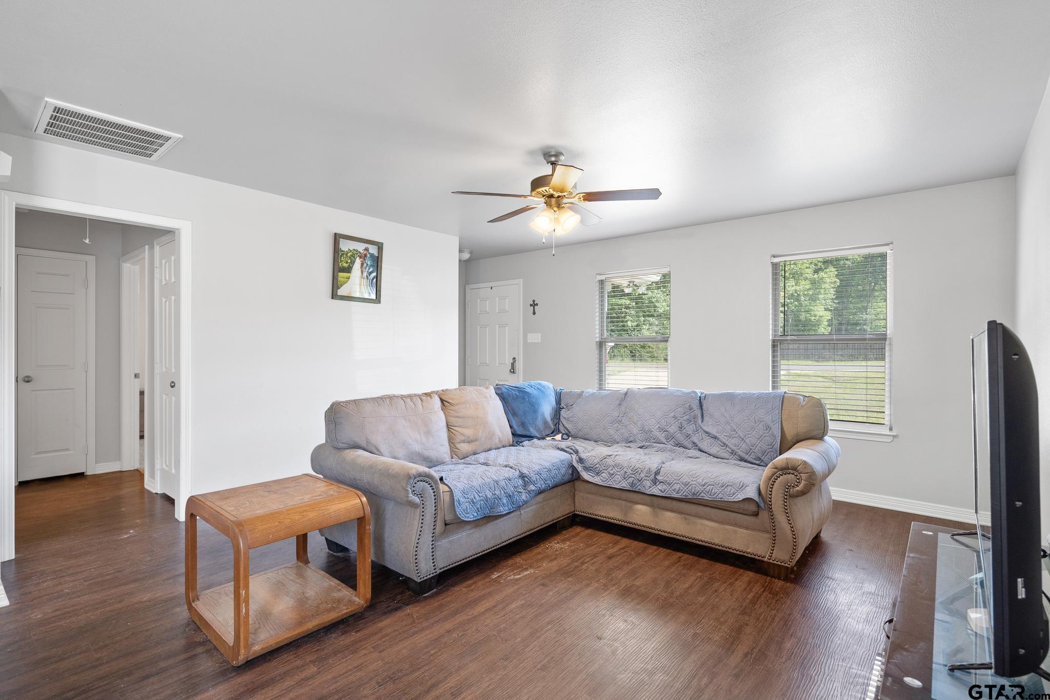 421 Alexander Street Kilgore, TX 75662 - Photo 6 of 24 a living room with furniture and a wooden floor