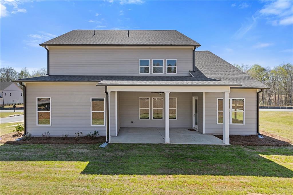 15 Overview Court Hoschton, GA 30548 - Photo 12 of 16 a view of a house with a yard