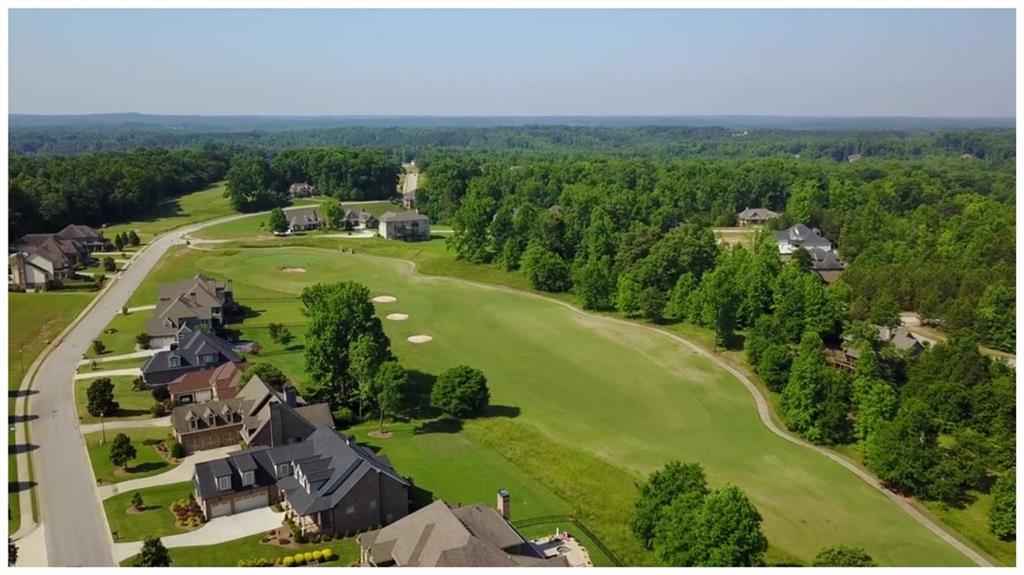 15 Overview Court Hoschton, GA 30548 - Photo 14 of 16 a view of a golf course with parking space