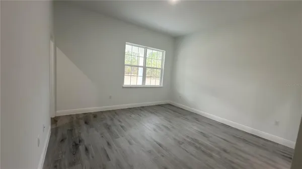 a bathroom with a double vanity sink and mirror