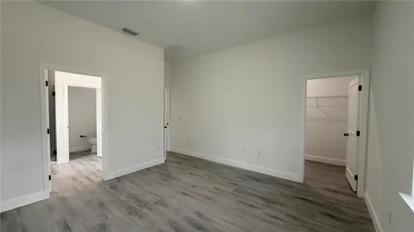 a white bath tub sitting next to a white sink