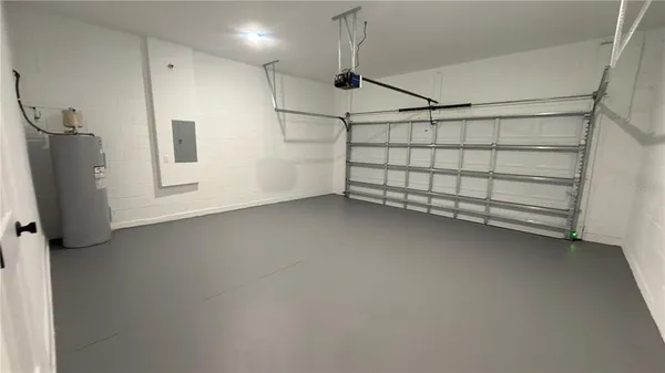 a white house that has a tree in front of it