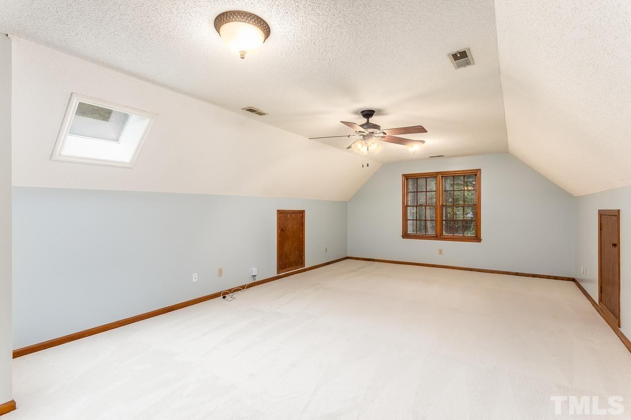 1841 Snow Wind Drive Raleigh, NC 27615 - Photo 22 of 29 an empty room with windows and fan