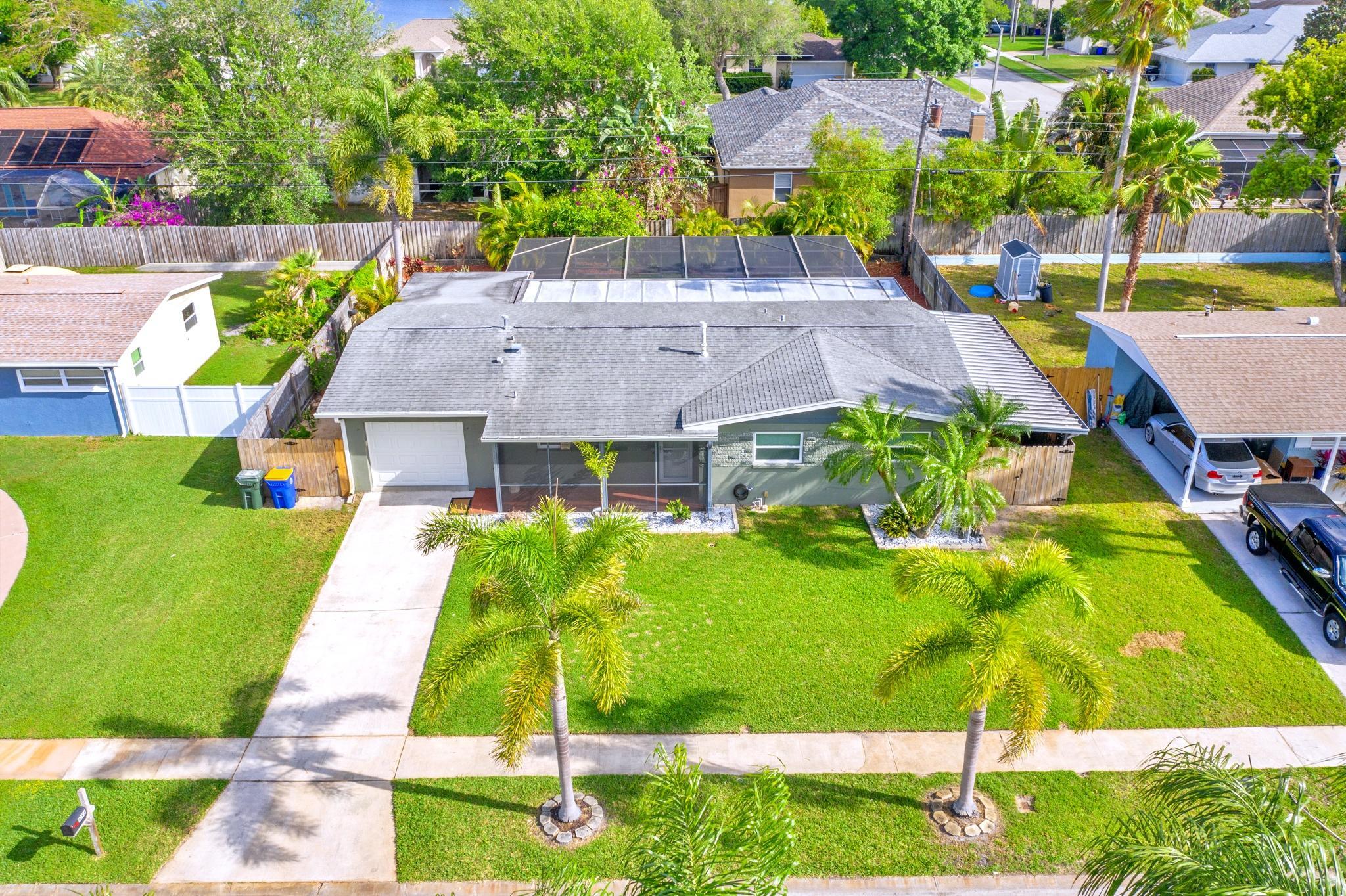 1096 Madrid Road Rockledge, FL 32955 - Photo 1 of 41 a view of a swimming pool with a garden