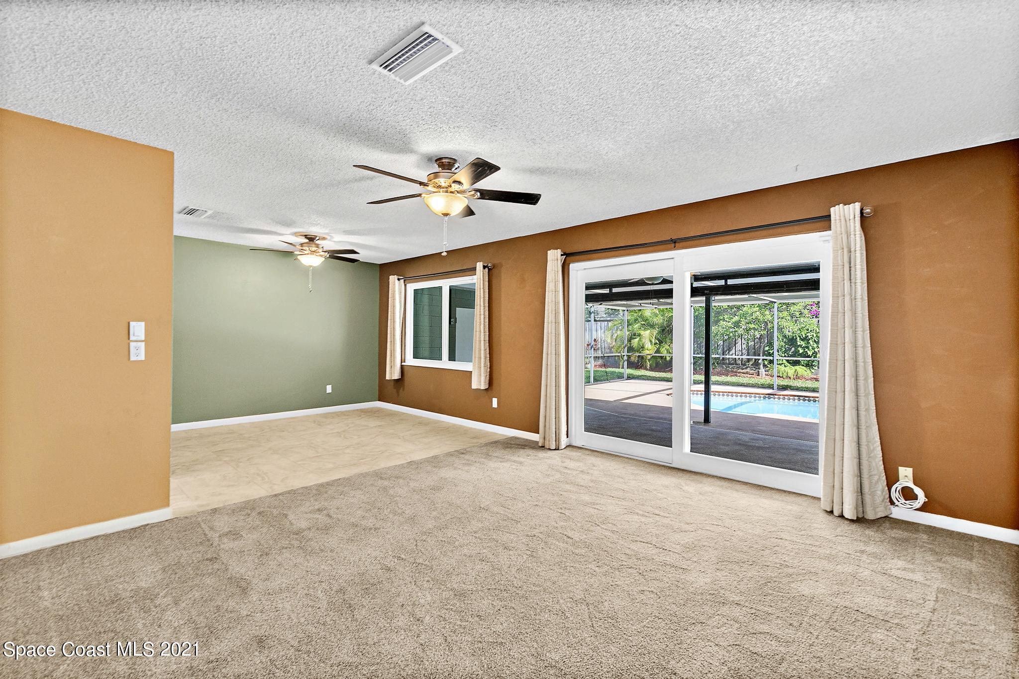 1096 Madrid Road Rockledge, FL 32955 - Photo 14 of 41 a view of an empty room with a window