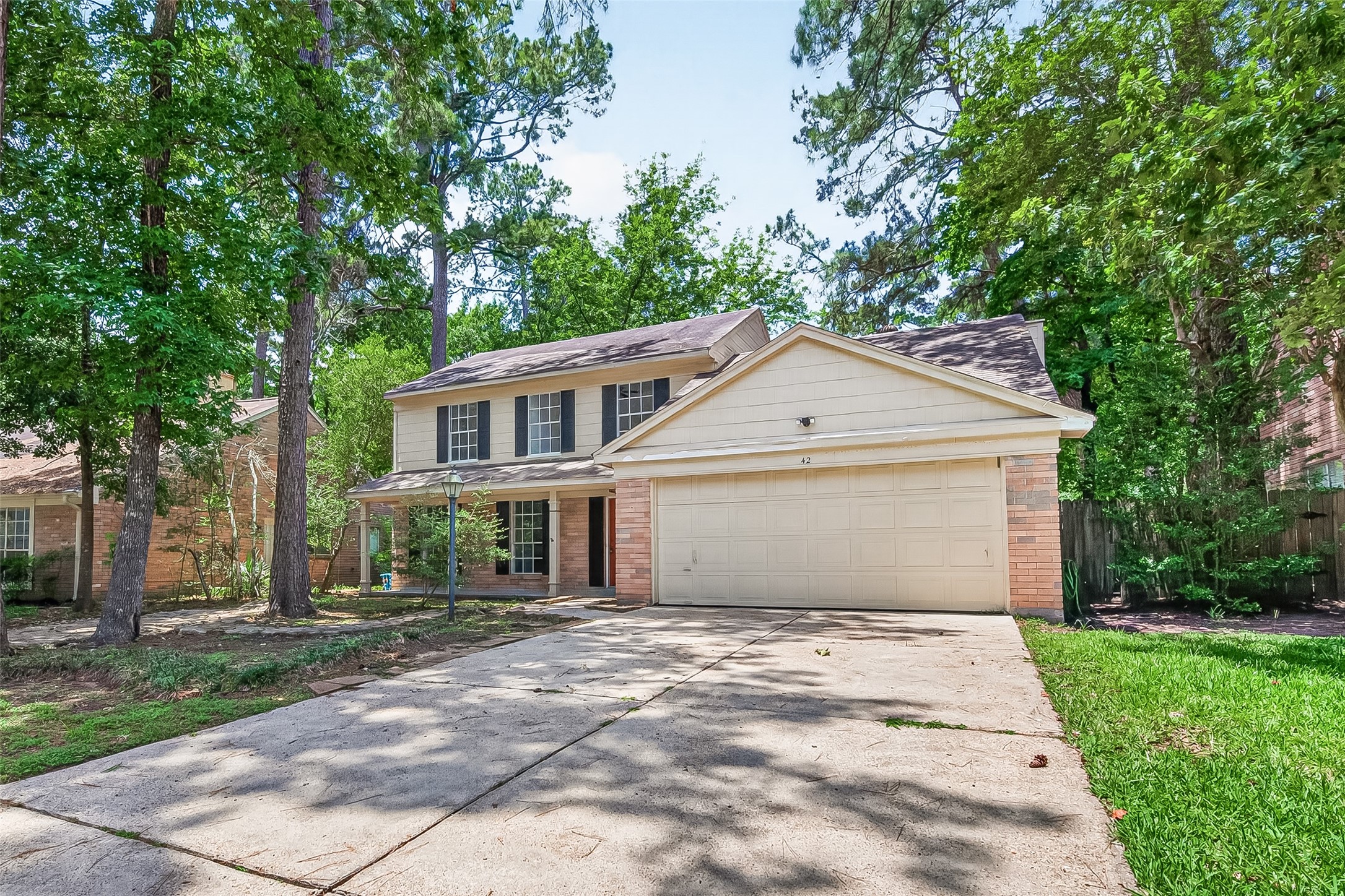 42 Rockridge Drive Spring, TX 77381 - Photo 2 of 39 Mature trees provide shade - the charm of The Woodlands.
