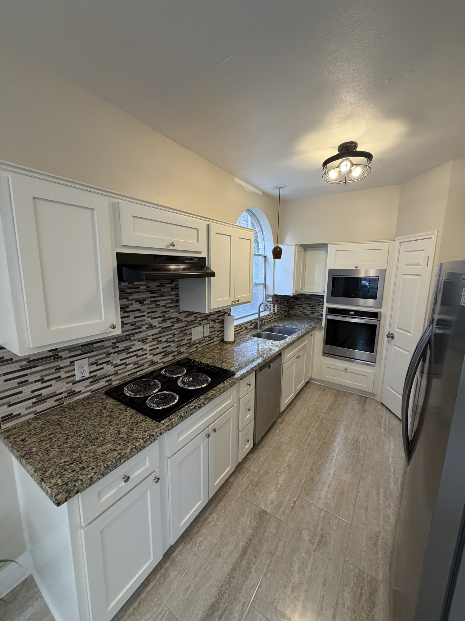 5515 Strack Road, Unit 121 Houston, TX 77069 - Photo 12 of 33 Nice kitchen featuring cabinets counter space, and a functional layout for everyday cooking.