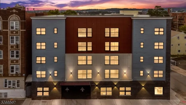 a front view of a building with glass windows