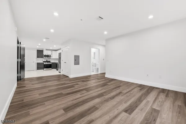 a view of kitchen and refrigerator