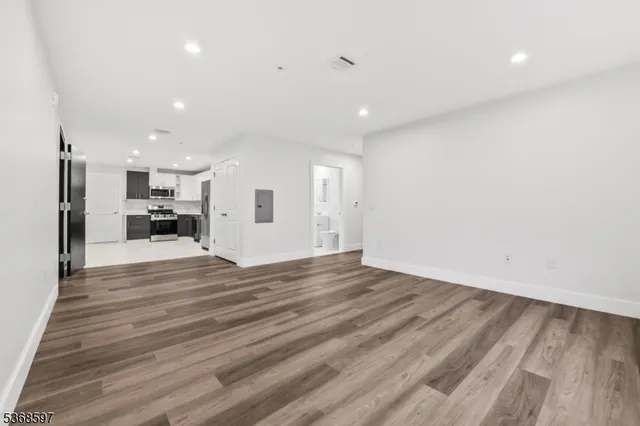 a view of kitchen and refrigerator