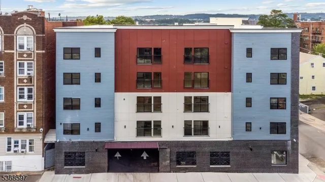 a front view of a building with glass windows