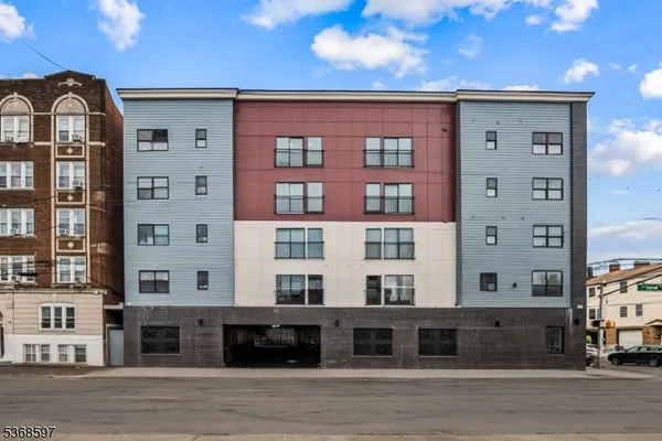 a front view of a building with a lot of windows
