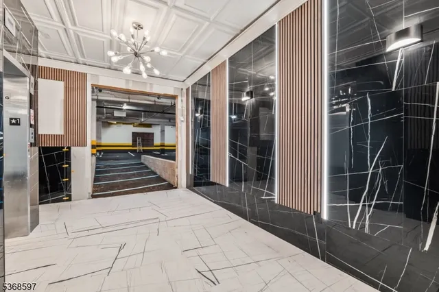 a view of hall way with furniture