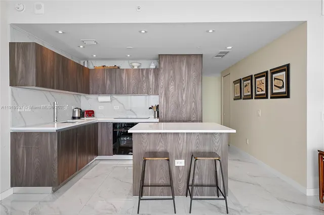 a bedroom with furniture and a large window