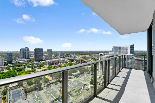 a bathroom with a double vanity sink and a large mirror