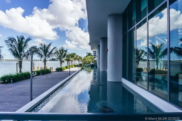 a view of swimming pool from a balcony